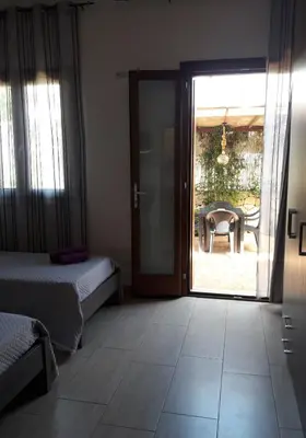 Letto o letti in una camera di Affittacamere Il FIORE