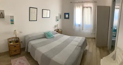 Letto o letti in una camera di Punta Sirenella