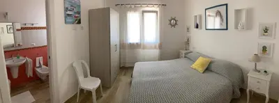 Letto o letti in una camera di Punta Sirenella