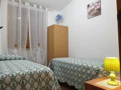 Letto o letti in una camera di Casa Luciano