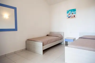 Letto o letti in una camera di San Teodoro