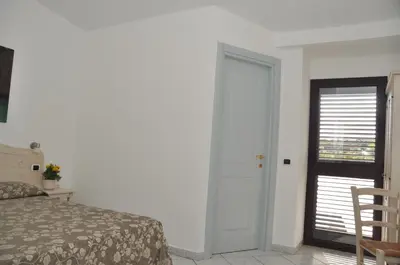 Letto o letti in una camera di Hotel Quasar