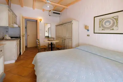 Letto o letti in una camera di Baia Caddinas Clubresidence