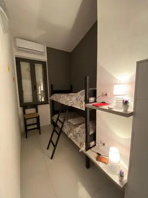 Letto o letti in una camera di Cala Gonone - Casa del Mirto