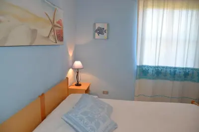 Letto o letti in una camera di Vacanze Sardegna Mare San Giovanni Posada