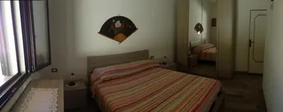 Letto o letti in una camera di Villa Gino