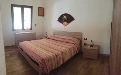 Letto o letti in una camera di Villa Gino