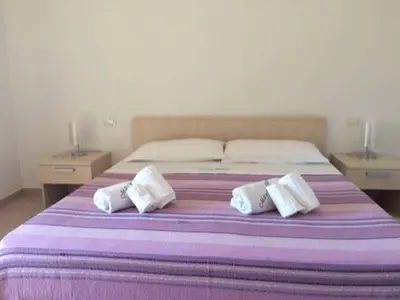 Letto o letti in una camera di Residence Arruli