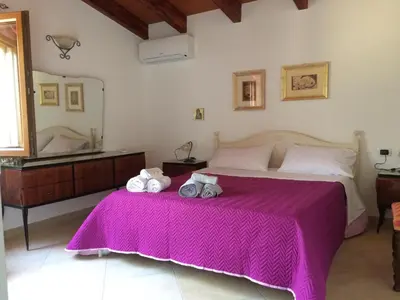 Letto o letti in una camera di S'umbra de S'ozzastru