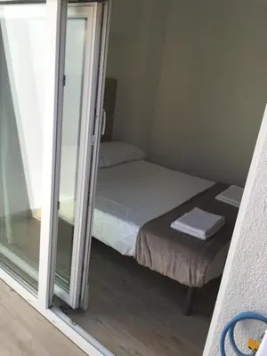 Letto o letti in una camera di Graffiti in Barbagia
