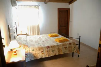 Letto o letti in una camera di Agriturismo Su Pirastru