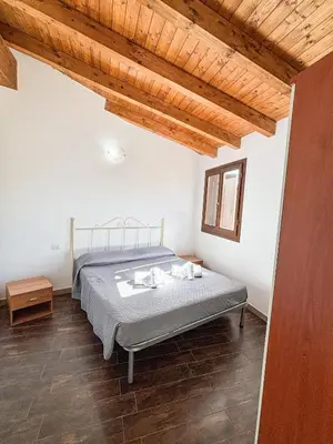 Letto o letti in una camera di Residenza Il Pappagallo