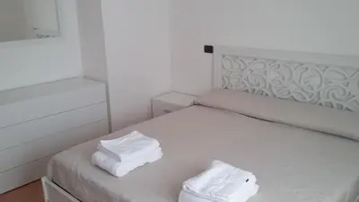 Letto o letti in una camera di Don Diego Apartment Orosei