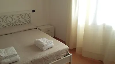 Letto o letti in una camera di Don Diego Apartment Orosei