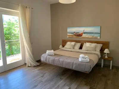 Letto o letti in una camera di Etesia