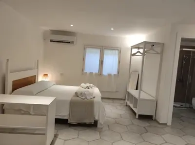 Letto o letti in una camera di Sardegna é - Villa Charme&Design
