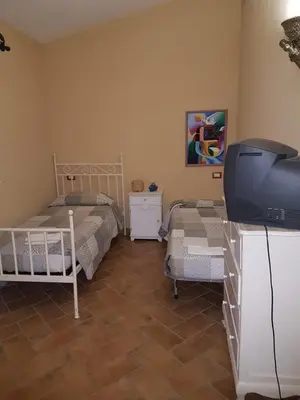 Letto o letti in una camera di Villetta Osseddu