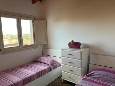 Letto o letti in una camera di Residenza Limpiddu