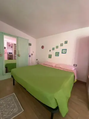 Letto o letti in una camera di Appartamenti accoglienti nel cuore di Siniscola