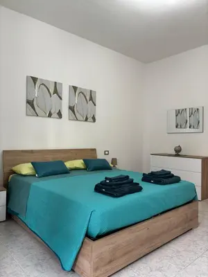 Letto o letti in una camera di Appartamenti accoglienti nel cuore di Siniscola