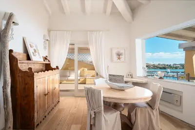 Area soggiorno di S'Abba seafront apartments - Your House in Sardinia