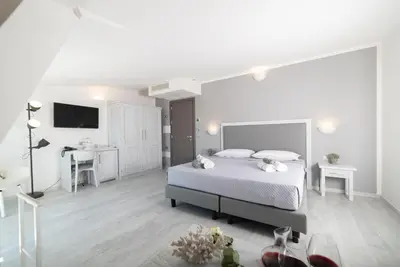 Letto o letti in una camera di Hotel Gli Ulivi