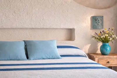 Letto o letti in una camera di Hotel Resort & Spa Baia Caddinas