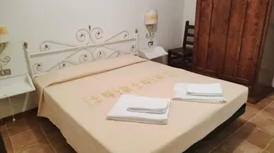 Letto o letti in una camera di Residence Spiaggia Bianca