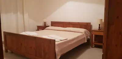 Letto o letti in una camera di Residence Spiaggia Bianca