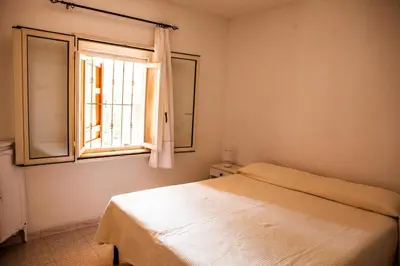 Letto o letti in una camera di Casa Vacanze a 200 mt spiaggia con 5 camere 2 bagni e 10 posti letto