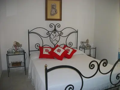 Letto o letti in una camera di Casa Tavolara