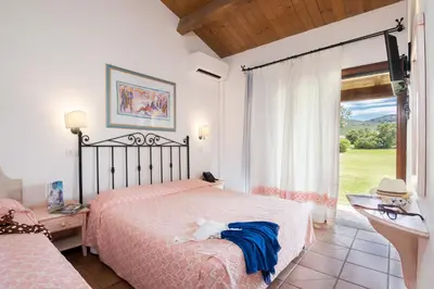 Letto o letti in una camera di TH San Teodoro - Liscia Eldi Village