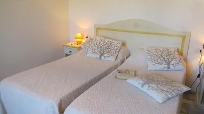 Letto o letti in una camera di Li Suari Club Village