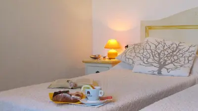 Letto o letti in una camera di Li Suari Club Village
