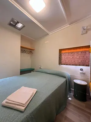 Letto o letti in una camera di Camping Car Palmasera