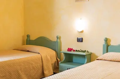Letto o letti in una camera di Albergo Residenziale Gli Ontani