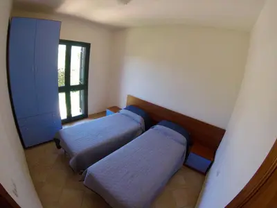 Letto o letti in una camera di Residence Edilmare San Teodoro