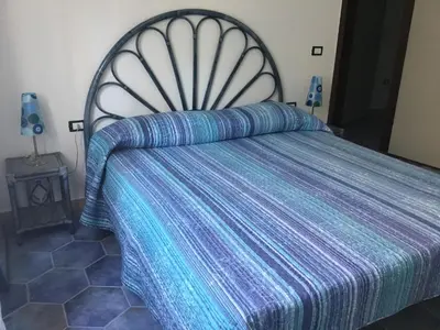 Letto o letti in una camera di appartamento Oleandro