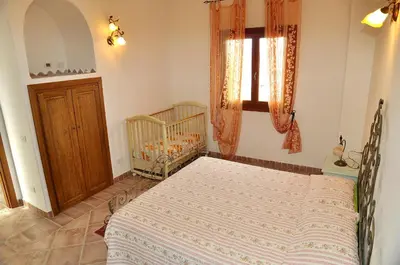 Letto o letti in una camera di villa i ginepri