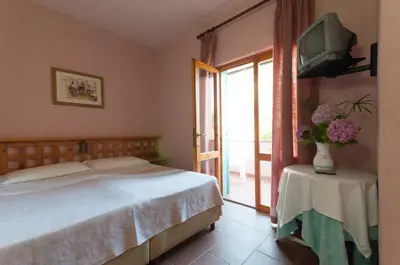 Letto o letti in una camera di Hotel Scintilla