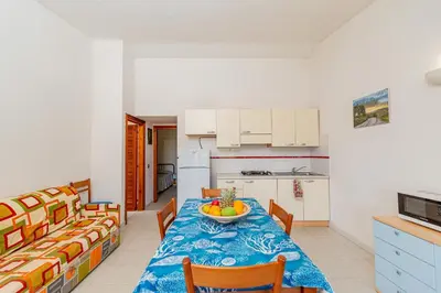 Cucina o angolo cottura di Appartamento Trilocale Le Canne 6 posti letto con giardino