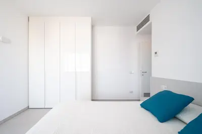 Letto o letti in una camera di Appartamenti Aironi - Your House in Sardinia