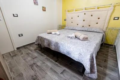 Letto o letti in una camera di Affittacamere L ' Oasi di Gino