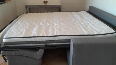 Letto o letti in una camera di Appartamento in residence fronte mare