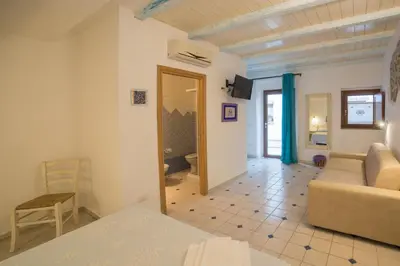 Area soggiorno di Olbia Domus Inn