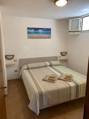 Letto o letti in una camera di Appartamenti Le Primule