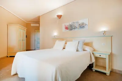 Letto o letti in una camera di Hotel Lu Pitrali
