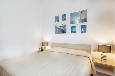 Letto o letti in una camera di Lu Maestrali Apartment