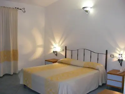 Letto o letti in una camera di Tenuta Su Vrau