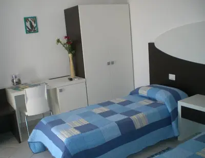 Letto o letti in una camera di Residence Olbia